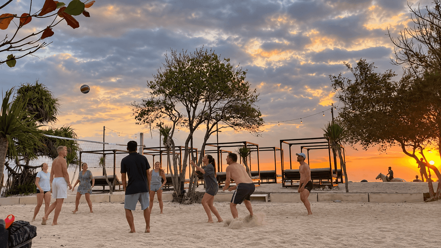 Beach volleyball on sunset beach