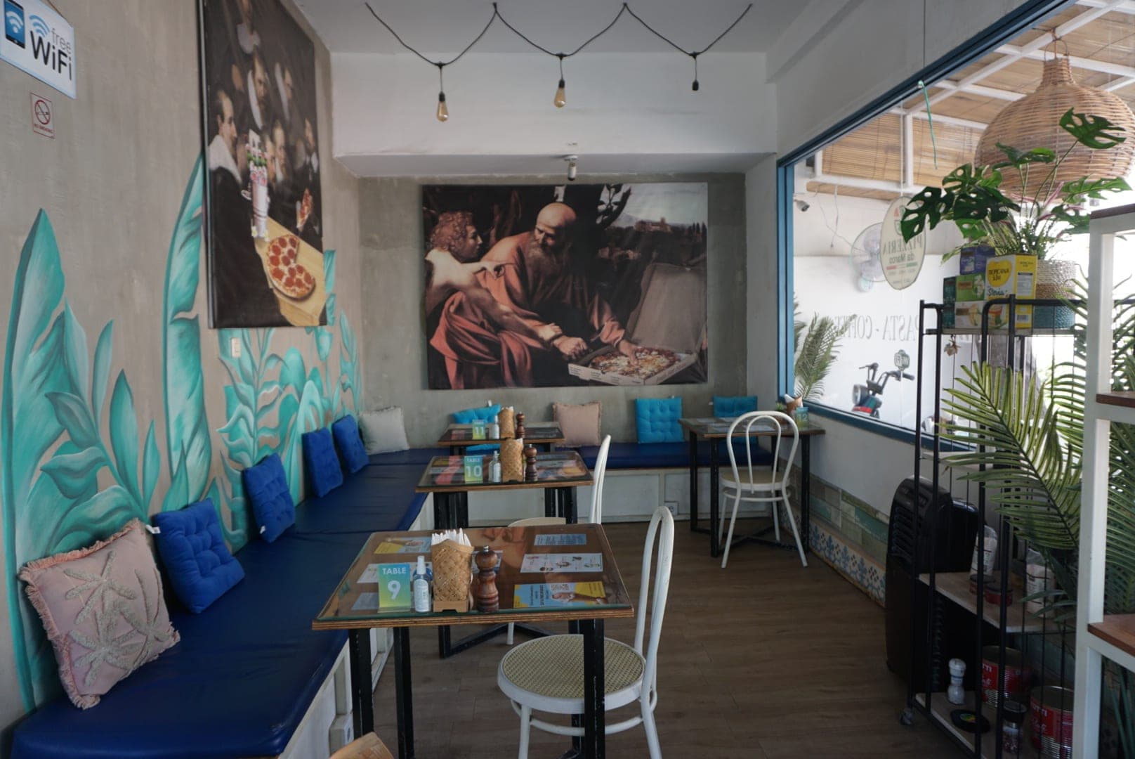 Artistic renaissance mural inside restaurant